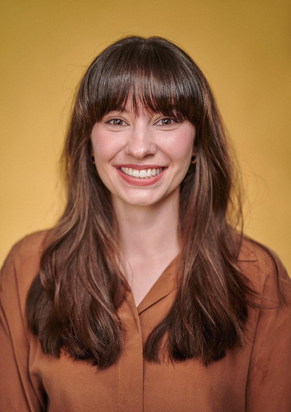 Studio actor headshot of Agata Frankowska with a green canvas backdrop, London
