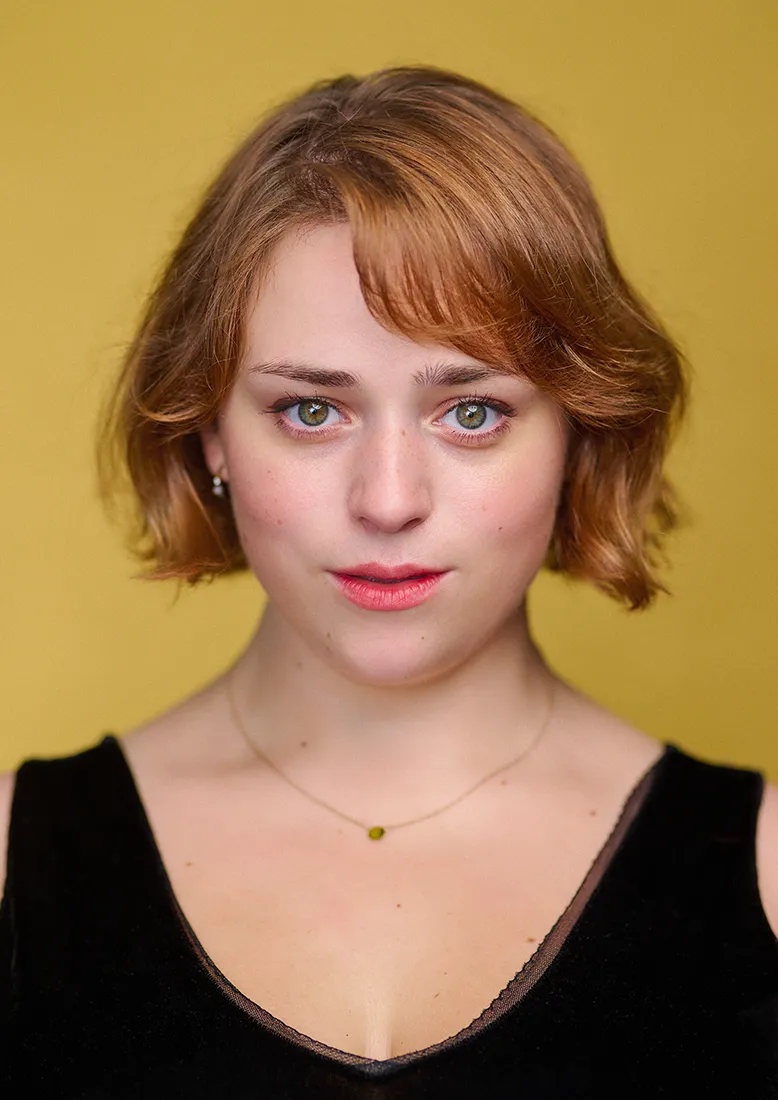 Mary's actor headshot in my London studio with a yellow backdrop.
