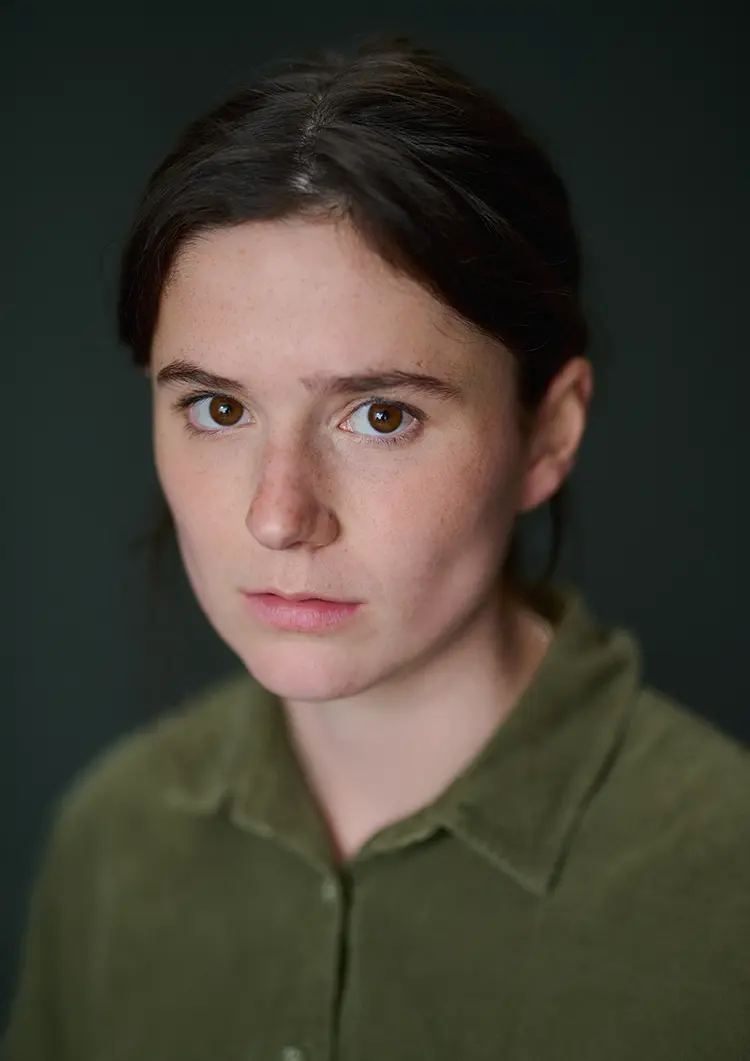 Daylight headshot of actress India McNicholas in my London studio with a dark canvas backdrop