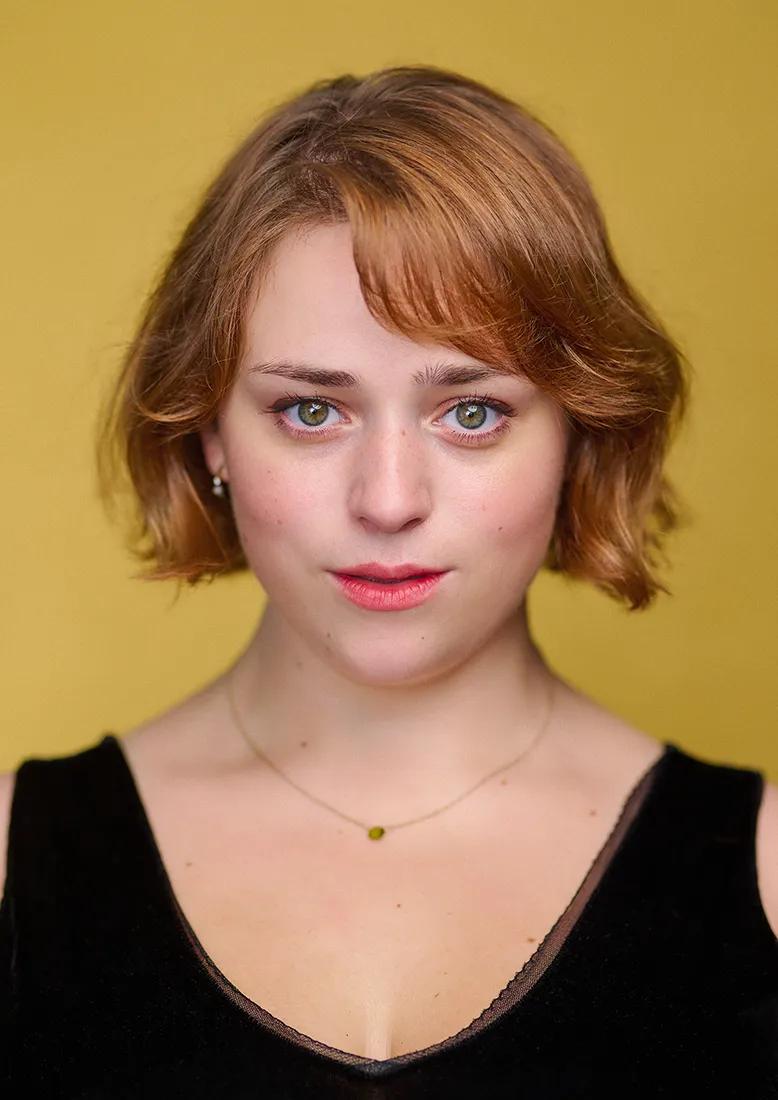 Mary's actor headshot in my London studio with a yellow backdrop.
