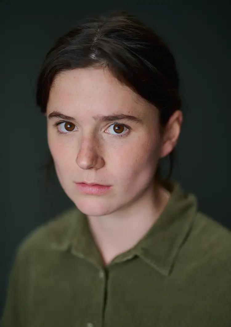 Daylight headshot of actress India McNicholas in my London studio with a dark canvas backdrop