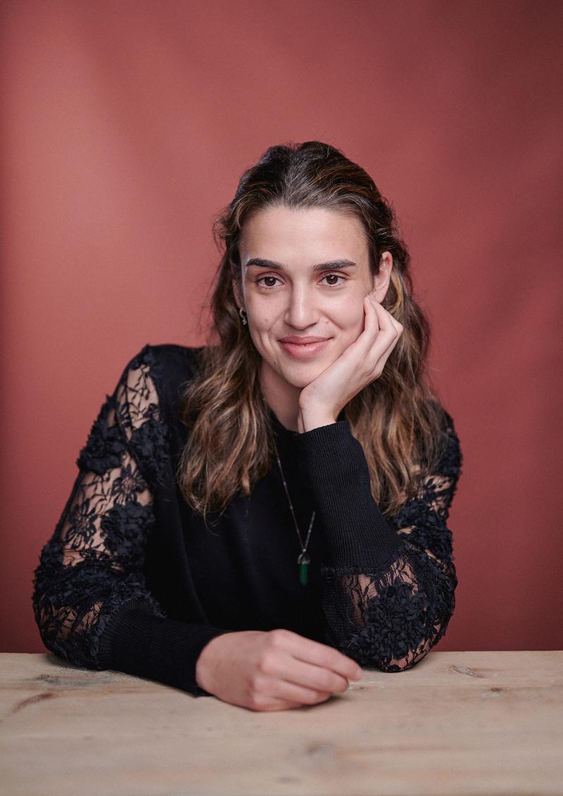 Author portrait of Lydia Goldman with a terracotta backdrop in my Herne Hill studio