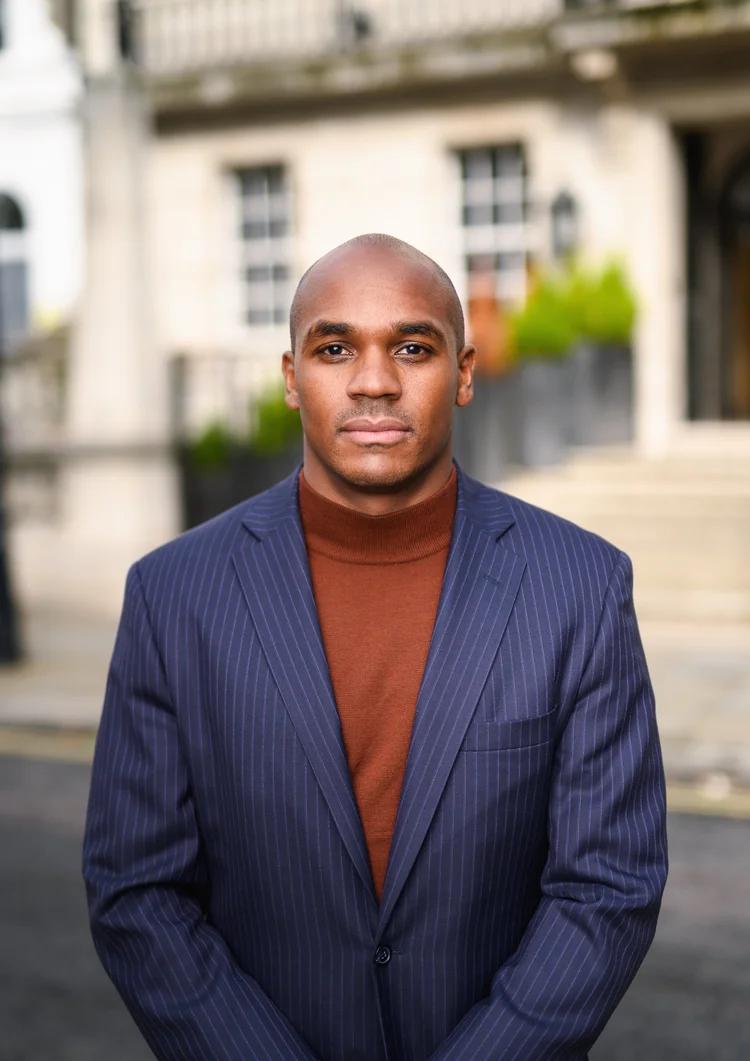 Outside business portrait of company director