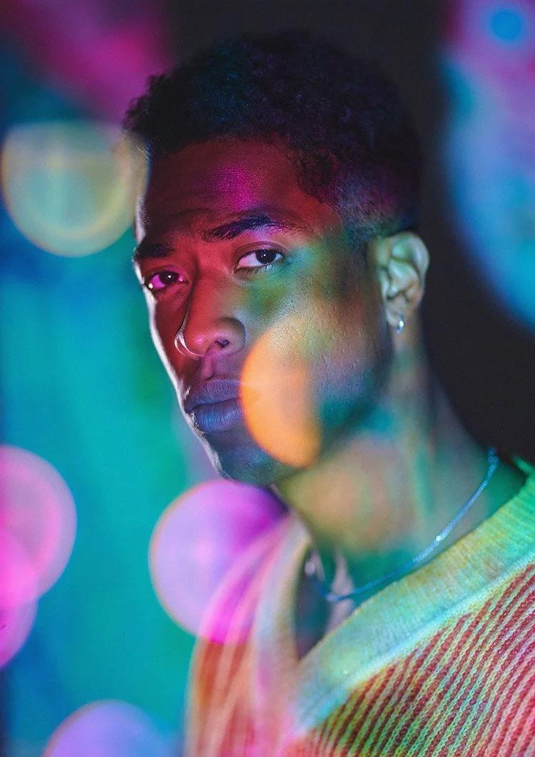 Actor portrait with colourful lights and bokeh. 