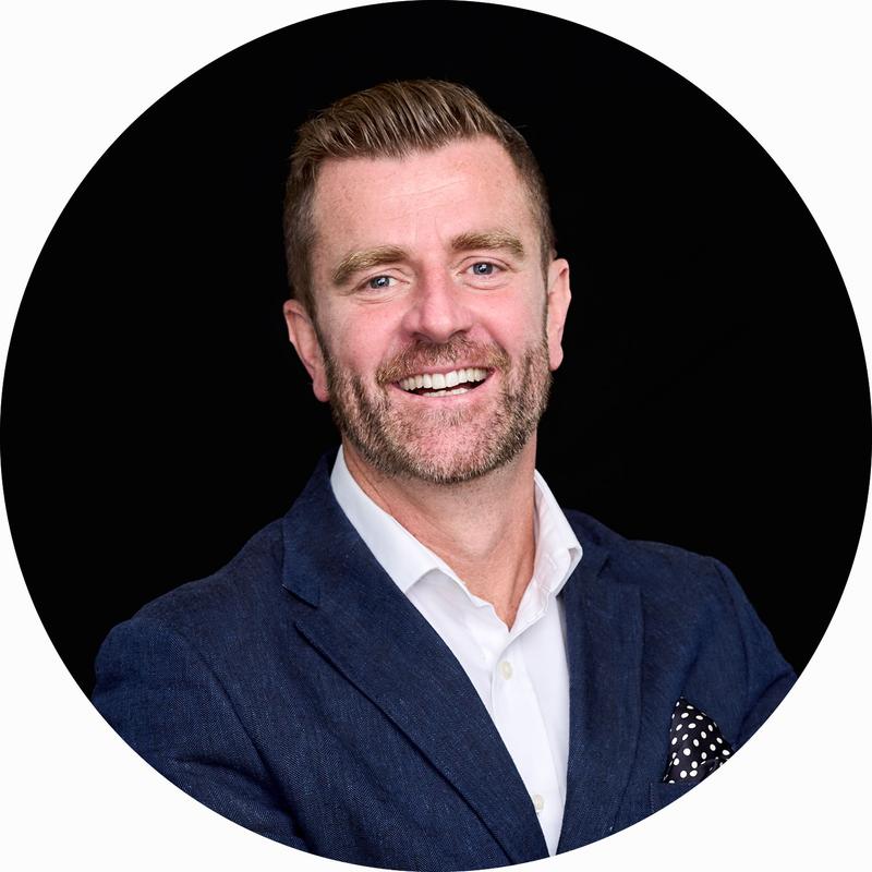 LinkedIn Headshot of businessman with a black background.