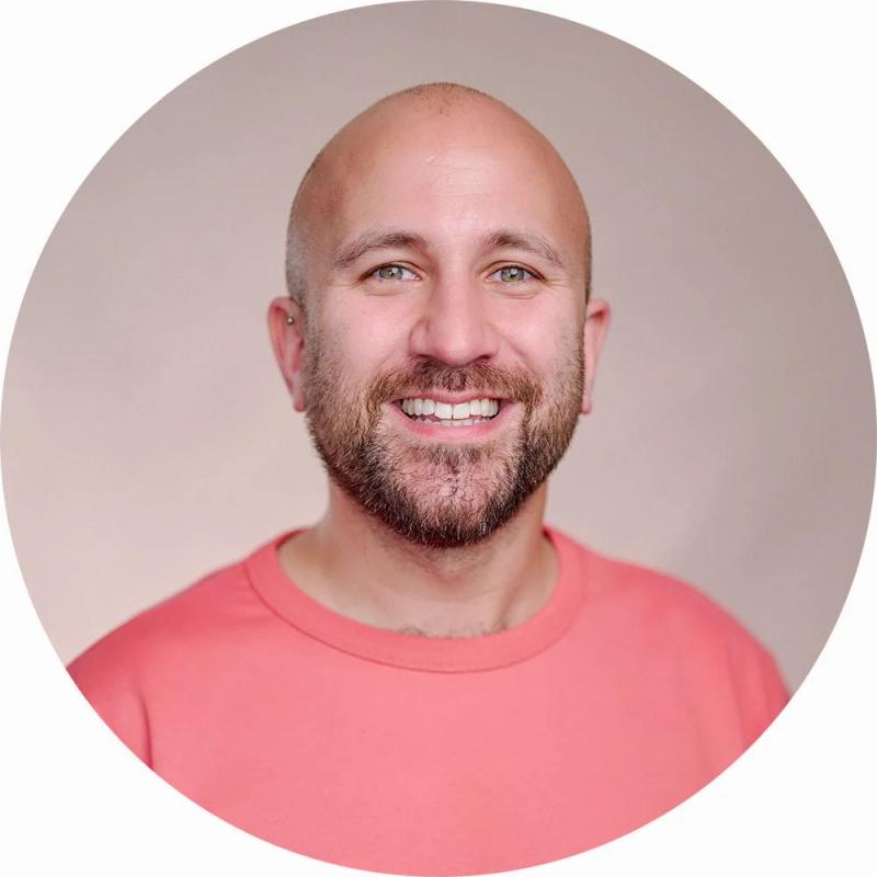 Professional LinkedIn headshot of Social Media Marketing Executive Liam, captured at my Herne Hill studio with a light pink canvas backdrop for personal branding.