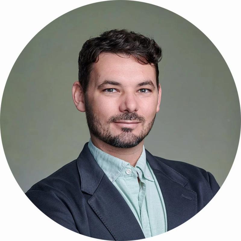 London Businessman Anton LinkedIn Headshot in Studio with green canvas backdrop