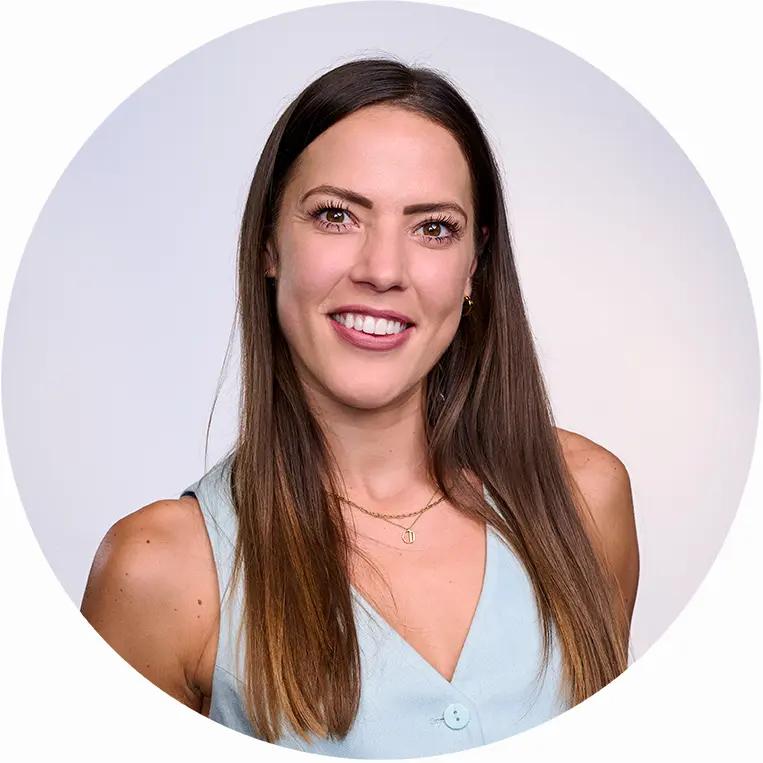 Professional business headshot of smiling woman with studio lighting and white background in London