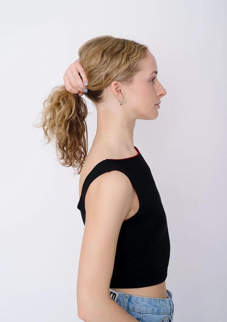 Female model polaroids London holding hair up natural pose