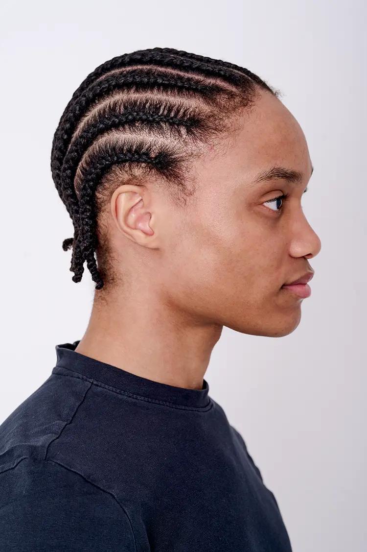 Male model side profile polaroid with white backdrop