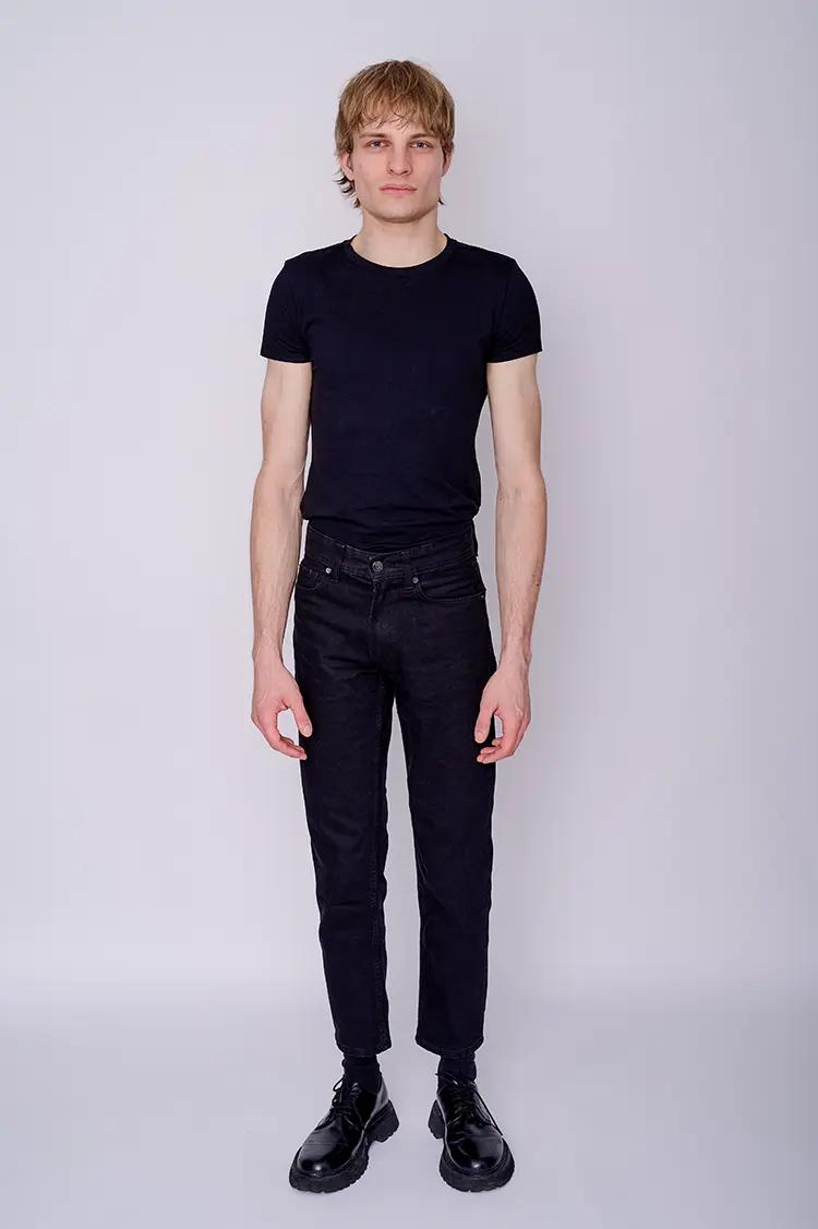 Full length model digital of male model in London studio with white backdrop
