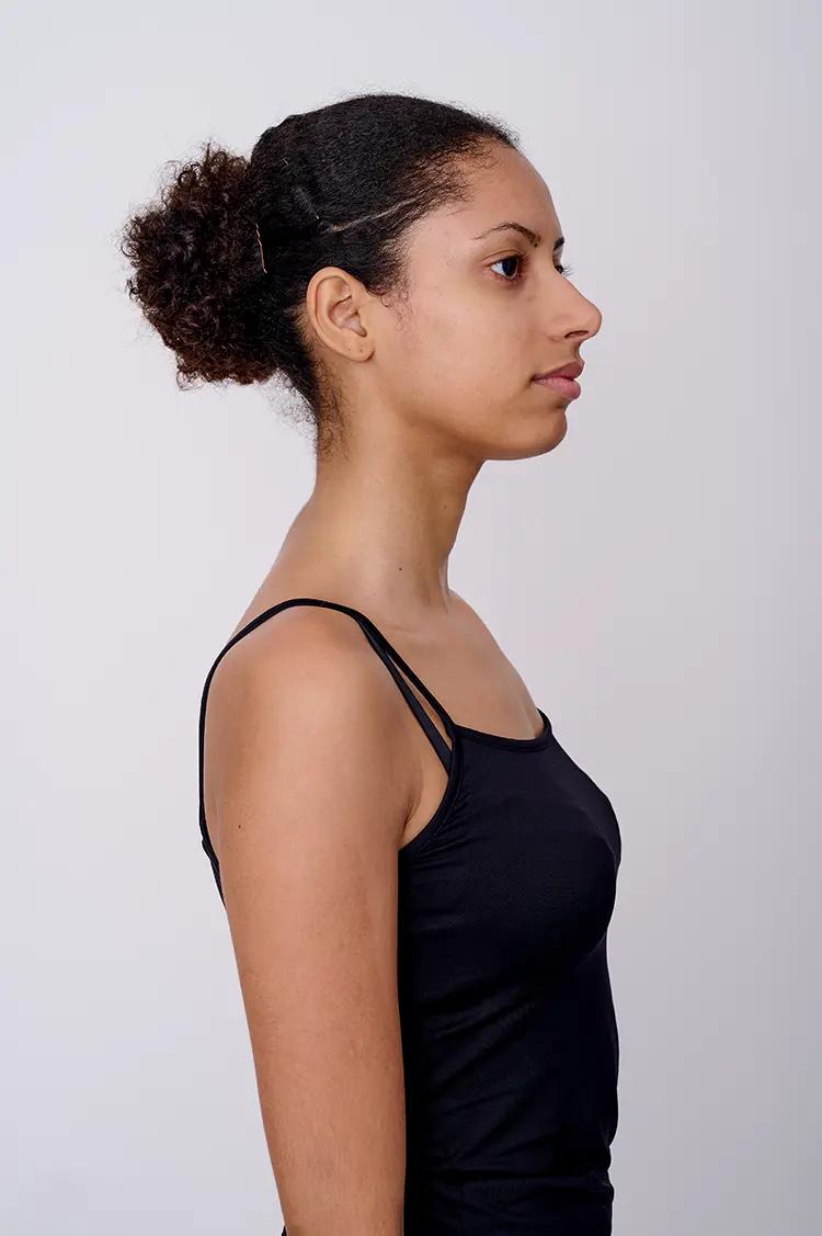 Side profile model digital with white backdrop and soft light.